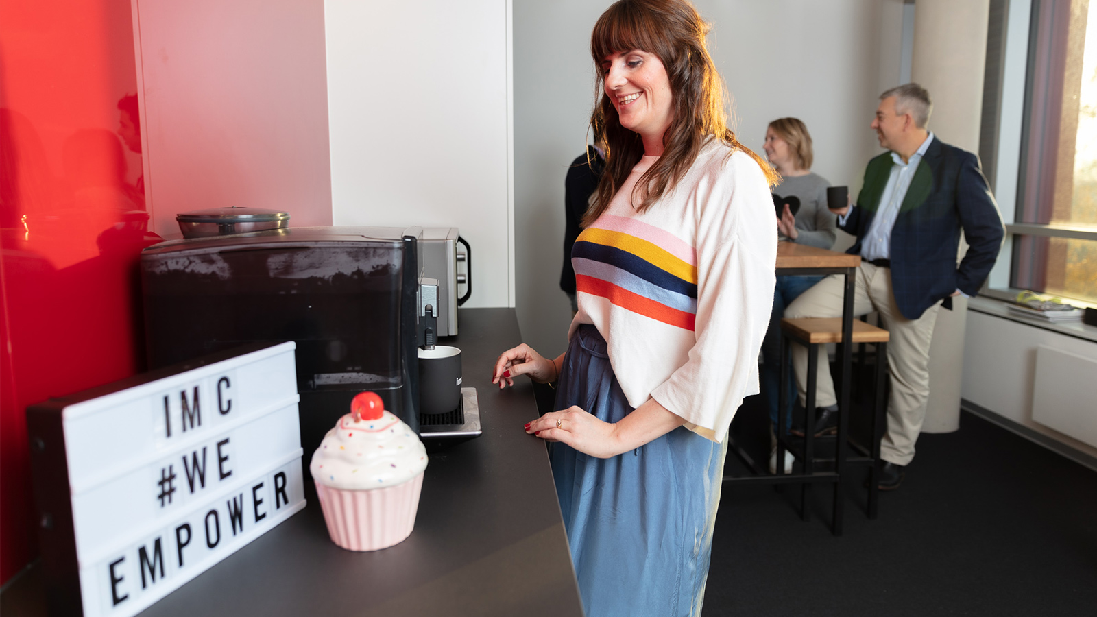 imc coworkes meeting for a coffee