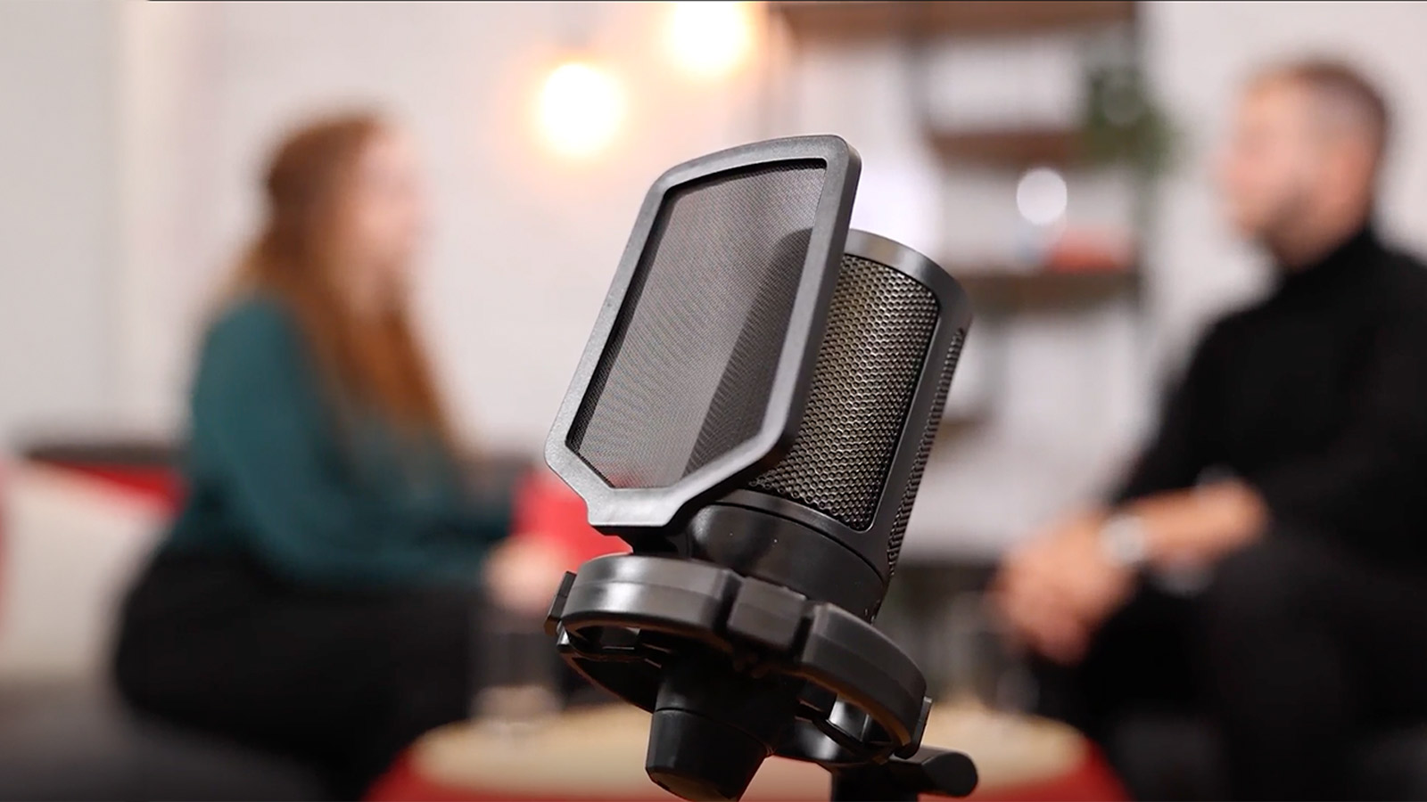 re:invented podcast header with host and guest sat in the background